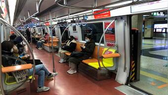 'End of an era': Beijing drops mandatory mask requirement for subway travellers