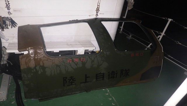 Army finds door, unused lifeboat in search for lost Japanse army helicopter Army finds door, unused lifeboat in search for lost Japanse army helicopter