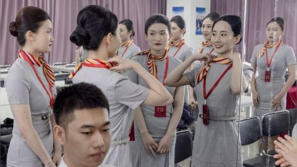 Youths in China rush to become flight attendants as travel rebounds after three years
