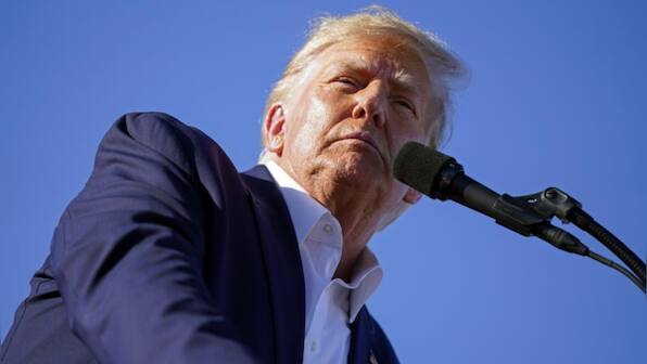 Former President Donald Trump set to travel to New York for his expected booking, arraignment