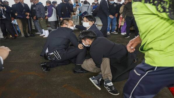 Japan PM resumes campaigning after evacuation from 'smoke bomb' blast