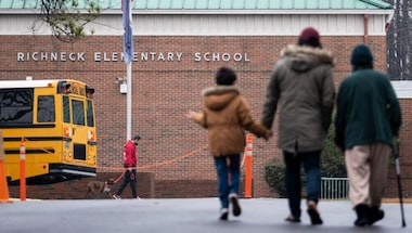 Virginia: Mother of six-year-old boy who shot school teacher charged with child neglect