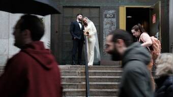 Captive audience: Couples marry in shadow of Donald Trump's arraignment at New York courthouse