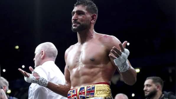 Ex-world champion Amir Khan handed two-year ban for doping