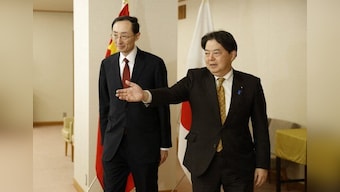 'Don't help a villain', China urges Japan not to back US tech restriction as the two nations hold talks