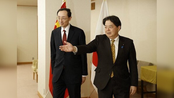 'Don't help a villain', China urges Japan not to back US tech restriction as the two nations hold talks