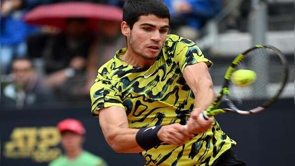 Italian Open: Carlos Alcaraz marks world number one spot with victory in soaking Rome