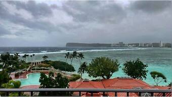 Rain, winds lash Guam as Typhoon Mawar closes in and residents shelter