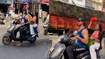 WATCH | Maharashtra couple bathe on a moving scooter, police swing into action after netizens protest