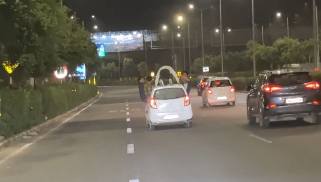 Watch: Man performs push-ups on top of moving car in Gurugram; case registered Watch: Man performs push-ups on top of moving car in Gurugram; case registered