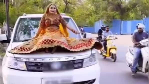 UP bride fined over Rs 15,000 for riding on top of a moving SUV; video goes viral