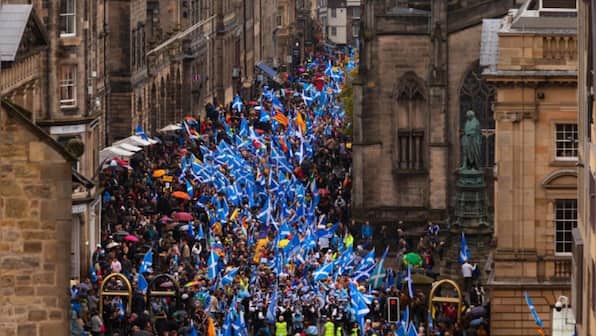 Scottish independence supporters march Glasgow streets during coronation