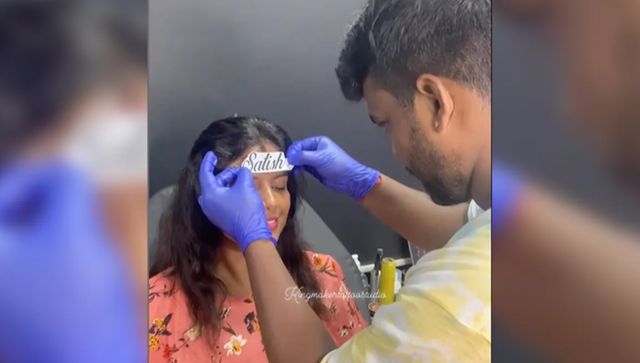 Viral video: Woman gets her husband's name tattooed on her head Viral video: Woman gets her husband's name tattooed on her head