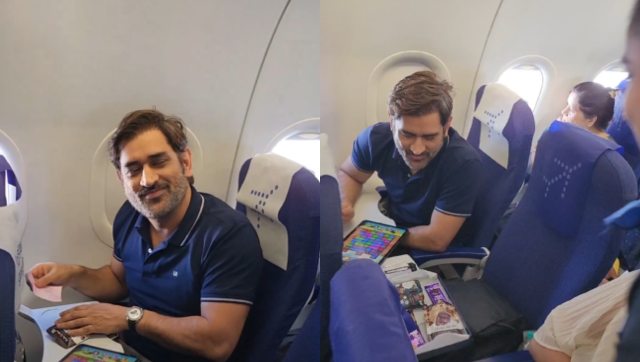 Watch: MS Dhoni plays Candy Crush as air hostess offers him chocolates Watch: MS Dhoni plays Candy Crush as air hostess offers him chocolates