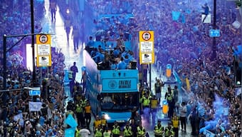 Watch: Manchester City enjoy historic treble with bus parade despite rain