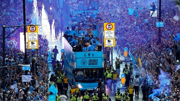 Watch: Manchester City enjoy historic treble with bus parade despite rain