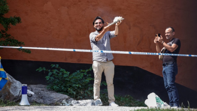 Man tears up, burns Quran outside Stockholm mosque on Eid holiday Man tears up, burns Quran outside Stockholm mosque on Eid holiday