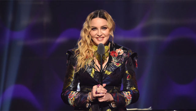 Madonna spends several days in an intensive care unit after becoming ill, postpones upcoming Celebration tour Madonna spends several days in an intensive care unit after becoming ill, postpones upcoming Celebration tour