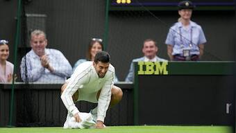 Watch: Novak Djokovic uses towel to dry Centre Court surface before his win over Pedro Cachin at Wimbledon