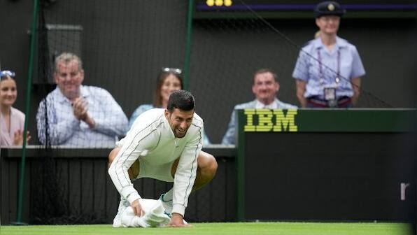 Watch: Novak Djokovic uses towel to dry Centre Court surface before his win over Pedro Cachin at Wimbledon