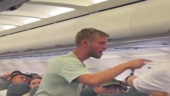 WATCH: 'Full chaos' as furious 'British boxer' tries to open plane door, other passengers throw him on floor