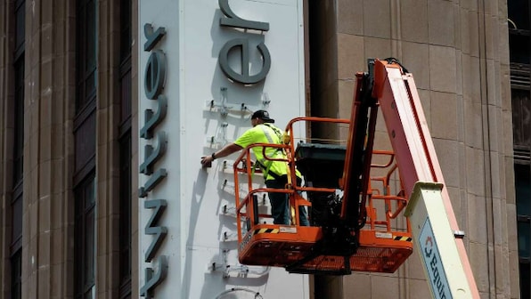 Twitter staff trying to remove the older logo from their building get detained by the police