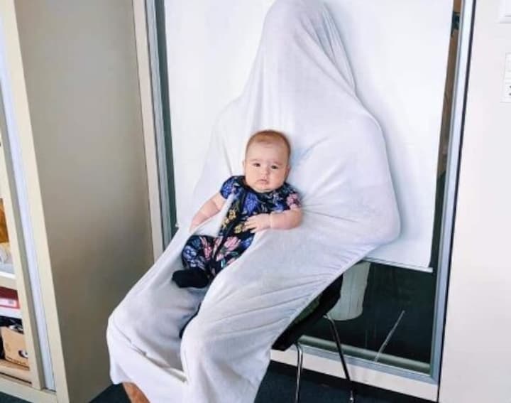 Dad's smart trick to make toddler's passport photos possible wins over internet