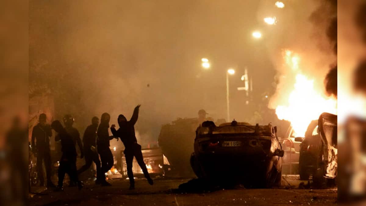 France Riots: Macron visits police barracks, Paris region transport ...