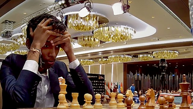 FIDE Chess World Cup R Praggnanandhaa plays out draw against Magnus Carslen in first game of final FIDE Chess World Cup R Praggnanandhaa plays out draw against Magnus Carslen in first game of final