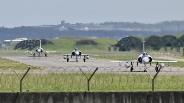 Taiwan warns of surge in tensions as Chinese planes cross median line