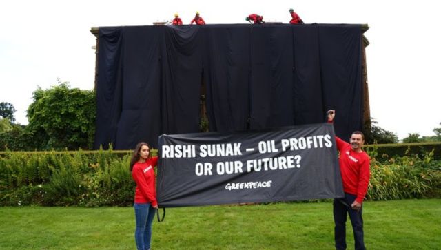 Rishi Sunak's London home draped in black by protesters over oil policy Rishi Sunak's London home draped in black by protesters over oil policy