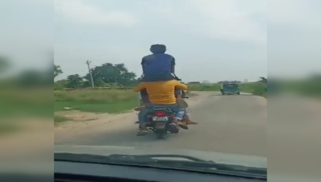 WATCH: In UP's Hapur, 7 youths ride a bike, one sits on pillion rider’s shoulder WATCH: In UP's Hapur, 7 youths ride a bike, one sits on pillion rider’s shoulder