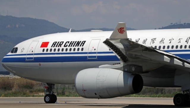 Air China jet evacuated after engine fire sends smoke into cabin in Singapore, nine injured Air China jet evacuated after engine fire sends smoke into cabin in Singapore, nine injured