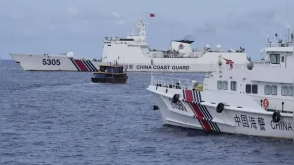 Philippines vows removal of Chinese barriers at disputed reef in South China Sea