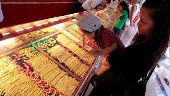 China gold premiums ease as safe-haven buying cools on stimulus hopes