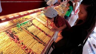China gold premiums ease as safe-haven buying cools on stimulus hopes