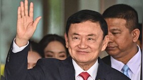 Thailand’s king reduces former Prime Minister Thaksin’s 8-year prison term to a single year