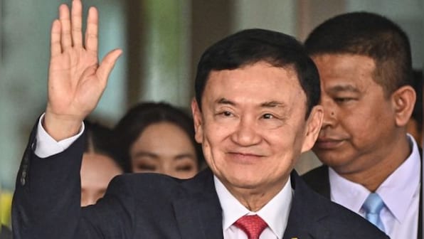 Thailand’s king reduces former Prime Minister Thaksin’s 8-year prison term to a single year