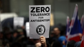 Man arrested for hanging swastikas, anti-Semitic banners on Florida bridge