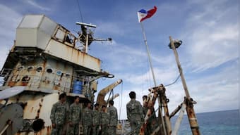 China slams Philippines over re-supply mission for troops on disputed atoll