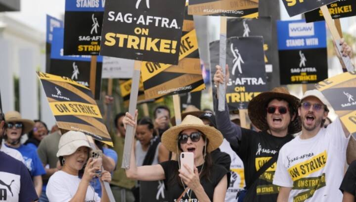 Hollywood writers vote to approve contract deal that ended strike as actors negotiate