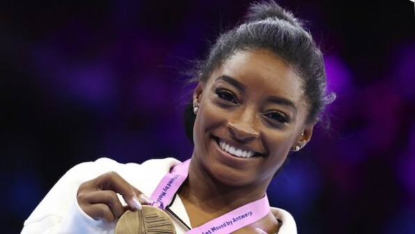 Simone Biles dazzles with beam and floor golds to reach 23 world titles