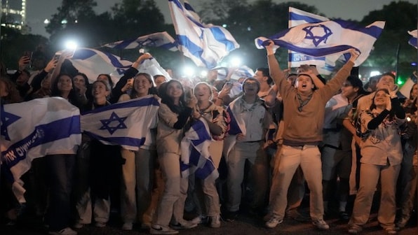 Hamas releases third group of hostages as part of truce, and says it will seek to extend the deal