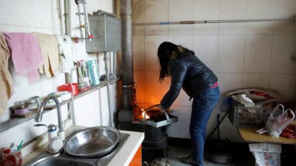 Controversial Clampdown: Chinese county imposes 'bizarre' fines on citizens for unmade beds, unwashed dishes at home