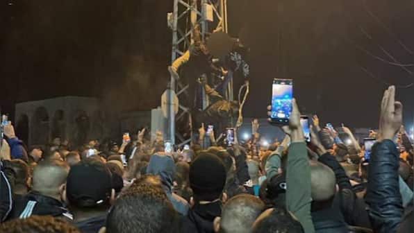 Crowds cheer as Hamas parades dead bodies after executing two Palestine civilians accused of spying for Israel