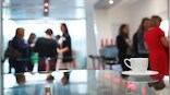 Hate returning to the office? This new workplace trend, coffee badging, is for you