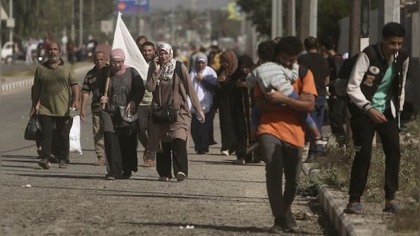 Why Gaza civilians are holding white flags as they flee Israeli assault