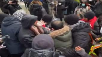 WATCH: Anti-Iran activist waving Canadian flag mauled by pro-Hamas crowd in Toronto as police watch on