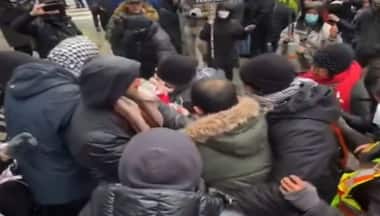 WATCH: Anti-Iran activist waving Canadian flag mauled by pro-Hamas crowd in Toronto as police watch on