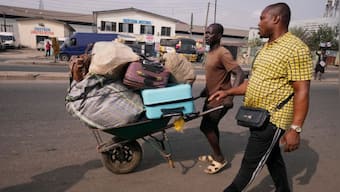 Nigeria slashes transport fees during the holidays to ease some of the pain of austerity measures